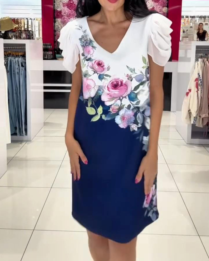 Vestido con mangas abullonadas y escote en pico, con estampado floral en color rosa.-ES