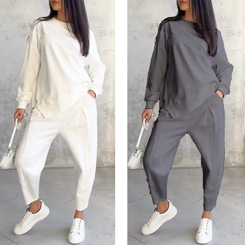 Conjunto femenino compuesto por una blusa de manga larga y pantalones con bajo irregular.-ES