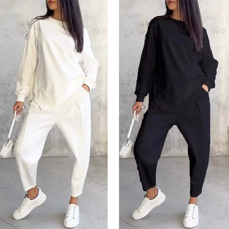 Conjunto femenino compuesto por una blusa de manga larga y pantalones con bajo irregular.-ES